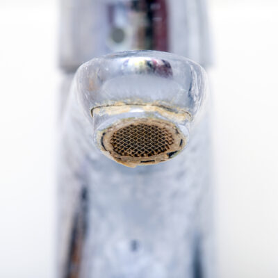 Close-up Dirty Faucet with limescale. Sink Faucet with Rust.