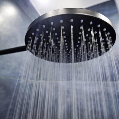 Water running from a black rain shower head